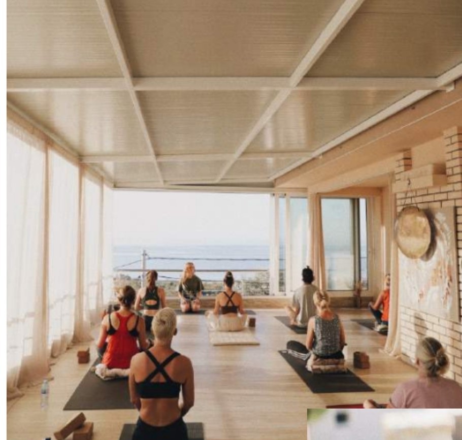 A yoga class practising in the airy shala at Mahakala Center