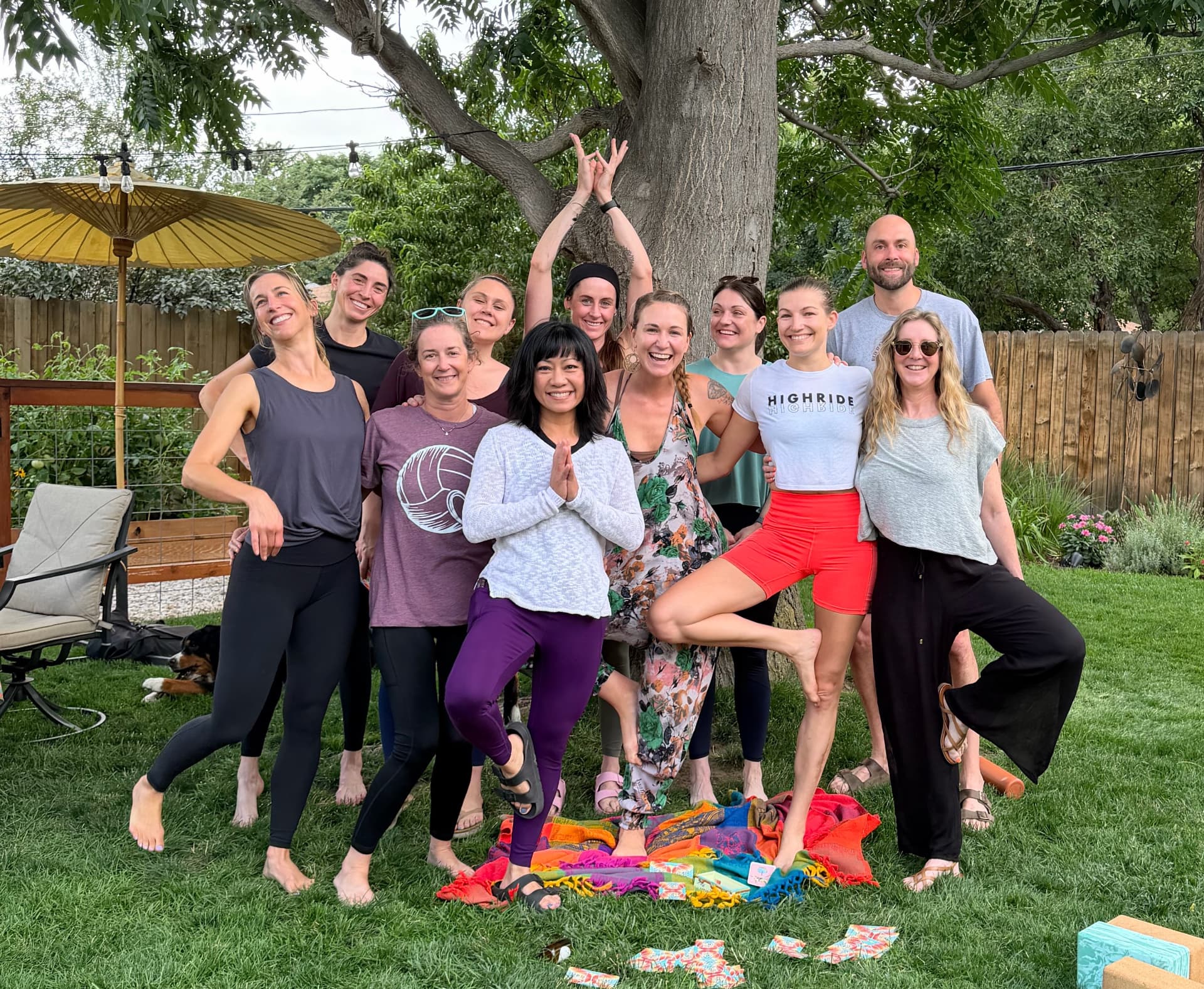 A group of women practicing yoga together outdoors in Denver
